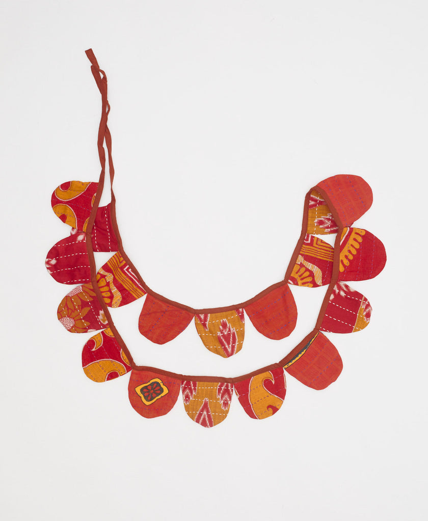 sustainable festive red and orange scalloped holiday garland