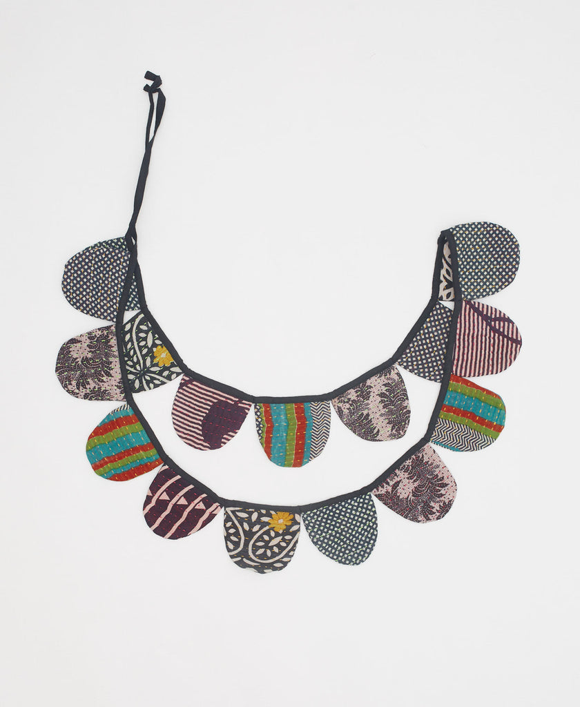 bold black and white scallop holiday garland with contrasting patterns and kantha stitching