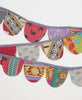 In hues of purple and red. this sustainable cotton garland is the perfect ecofriendly decoration  
