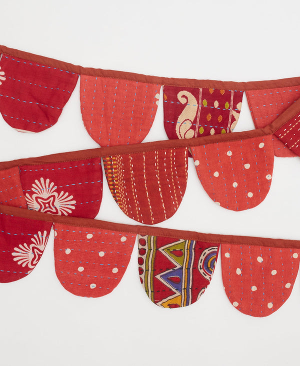 In hues of red, this sustainable cotton garland is the perfect  ecofriendly decoration 