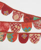 red eco-friendly party decor made of recycled vintage cotton saris with traditional patterns and kantha stitching