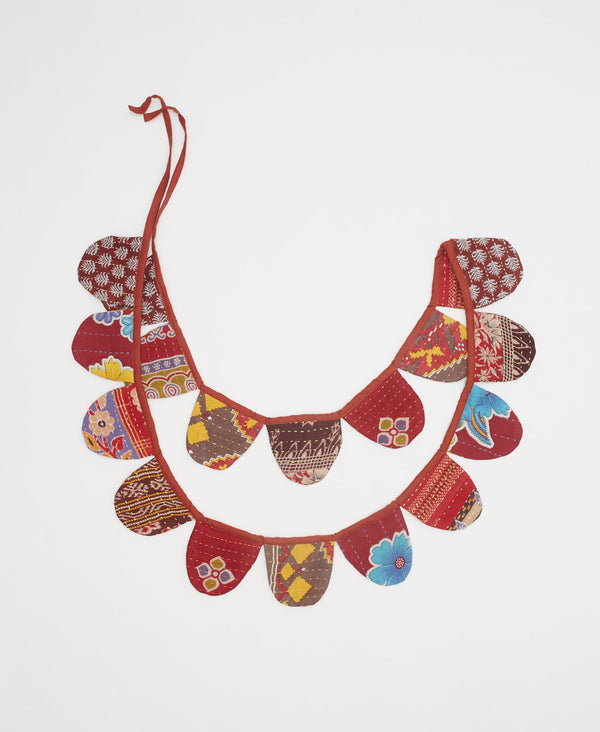 one-of-a-kind red scalloped holiday garland made of vintage kantha sraps