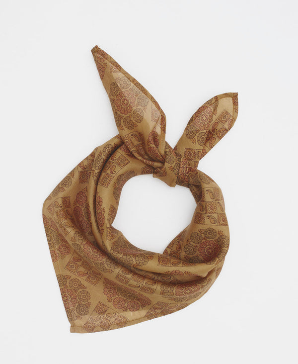 tan silk bandana with geometric floral and paisley patterns