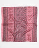 Artisan-made silk scarf with a paisley and floral pattern in hues of pink and black 