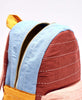small artisan-made backpack in colorful colorblock pattern by Anchal Project