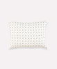 small lumbar throw pillow with small cross-stitch embroidery