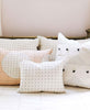 all neutral organic cotton bedspread with hand-embroidered throw pillows by Anchal