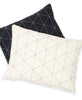 small back and white throw pillows with modern geometric embroidery