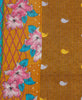 brown and orange soft cotton quilt with blue stitching, pink and blue flowers, and a pink lattice pattern