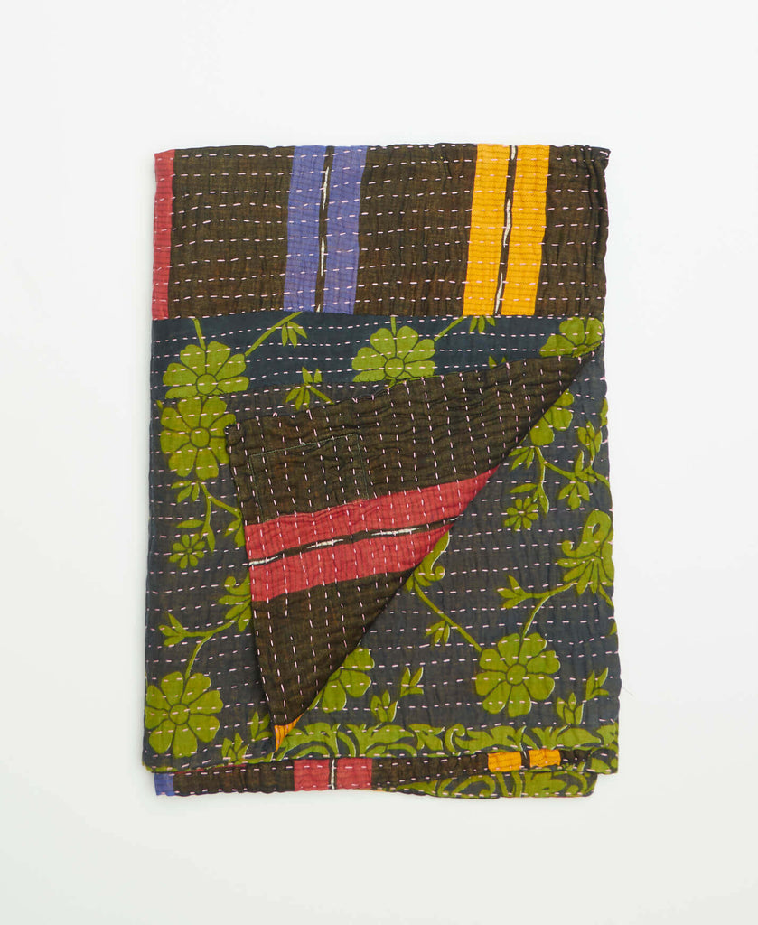 navy and brown small cotton throw blanket with green, purple, yellow, and red accents