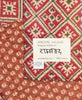 handmade kantha quilt throw with brown flowers and red and green ikat print