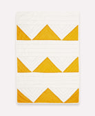 hand quilted organic cotton baby blanket with mustard yellow triangles