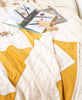 hand-stitched mustard yellow and bone ivory small quilt ethically made by Anchal artisans
