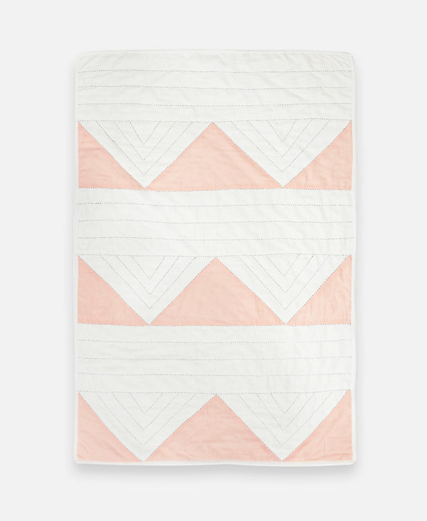 pink and white triangle baby quilt by Anchal Project