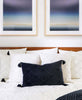monochromatic modernist bedroom pillow arrangement on bed