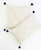 mathing set of organic cotton hand-embroidered throw pillows sewn by Anchal artisans