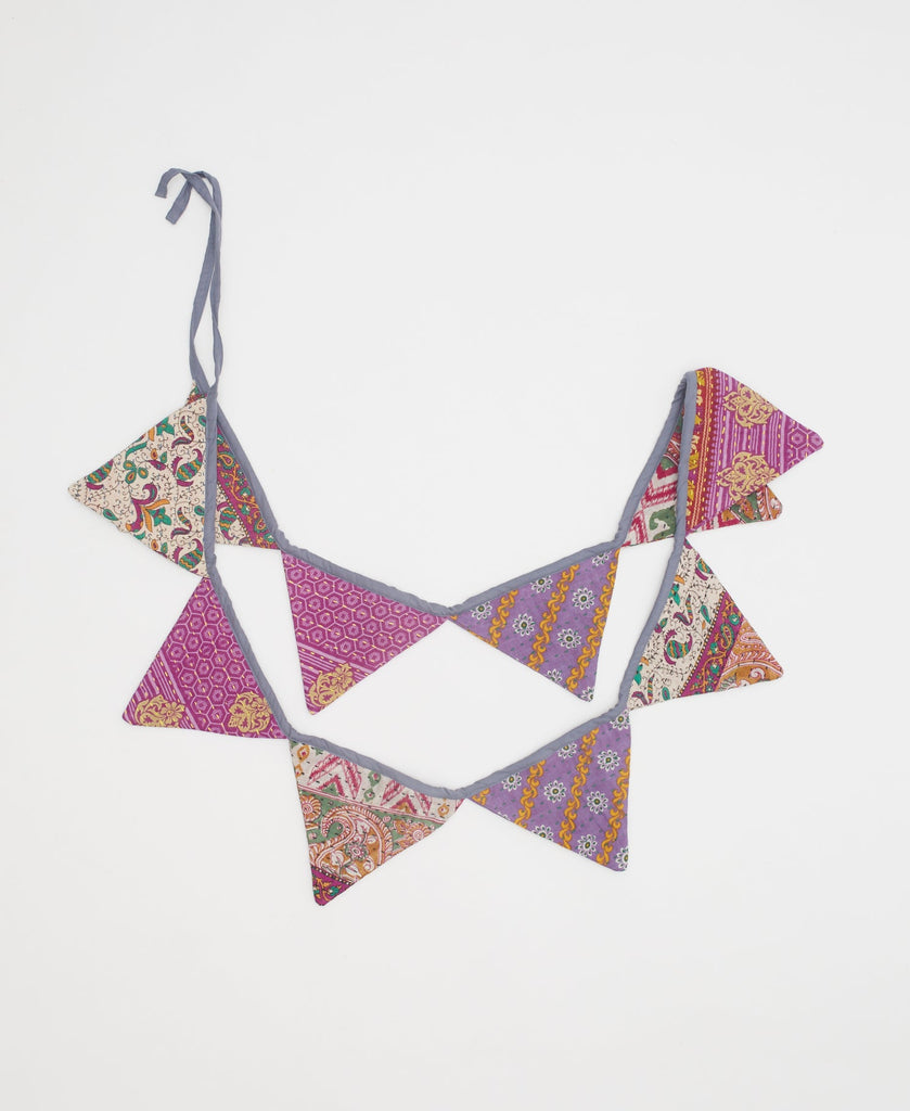 purple and magenta triangle flag garland with floral and bird details 