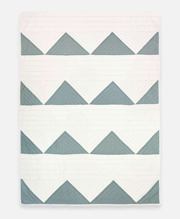 organic cotton hand-stitched quilt with geometric triangle design