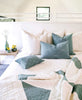 spring bedroom inspiration featuring ivory white and spruce green Anchal pillows