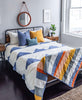 GOTS certified organic cotton duvet cover in slate blue in bright, sunny bedroom
