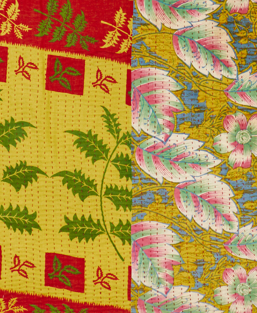 Bold contrasting patterns featured on an artisan made yellow throw quilt 