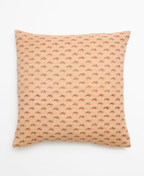 Beige vintage kantha throw pillow featuring a small red print through out 