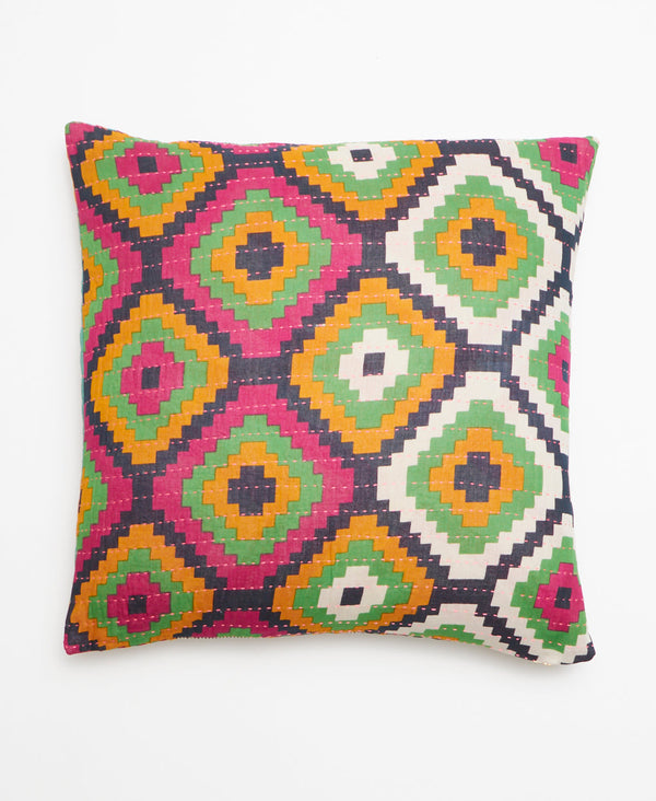 Large geometric print vintage kantha throw pillow featuring pink, green, orange, and white.