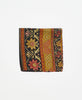 black pocket square made of repurposed vintage silk saris with red and green floral details