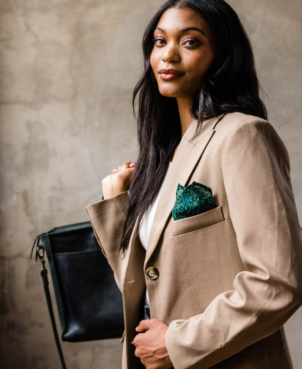 woman in camel blazer wearing an Anchal vintage silk pocket square in her pocket