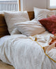 natural ivory bedding with grid design made from GOTS certified organic cotton